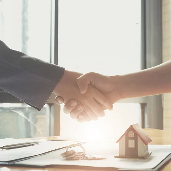 conveyancer in melbourne shaking hands with a seller buyer of property shaking hands with conveyancer